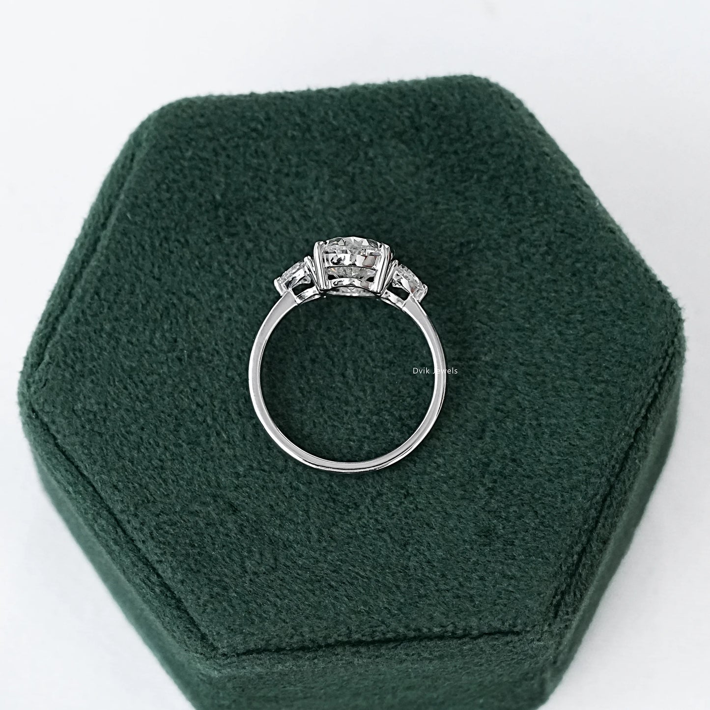 Three-Stone Oval And Round Cut Diamond Ring