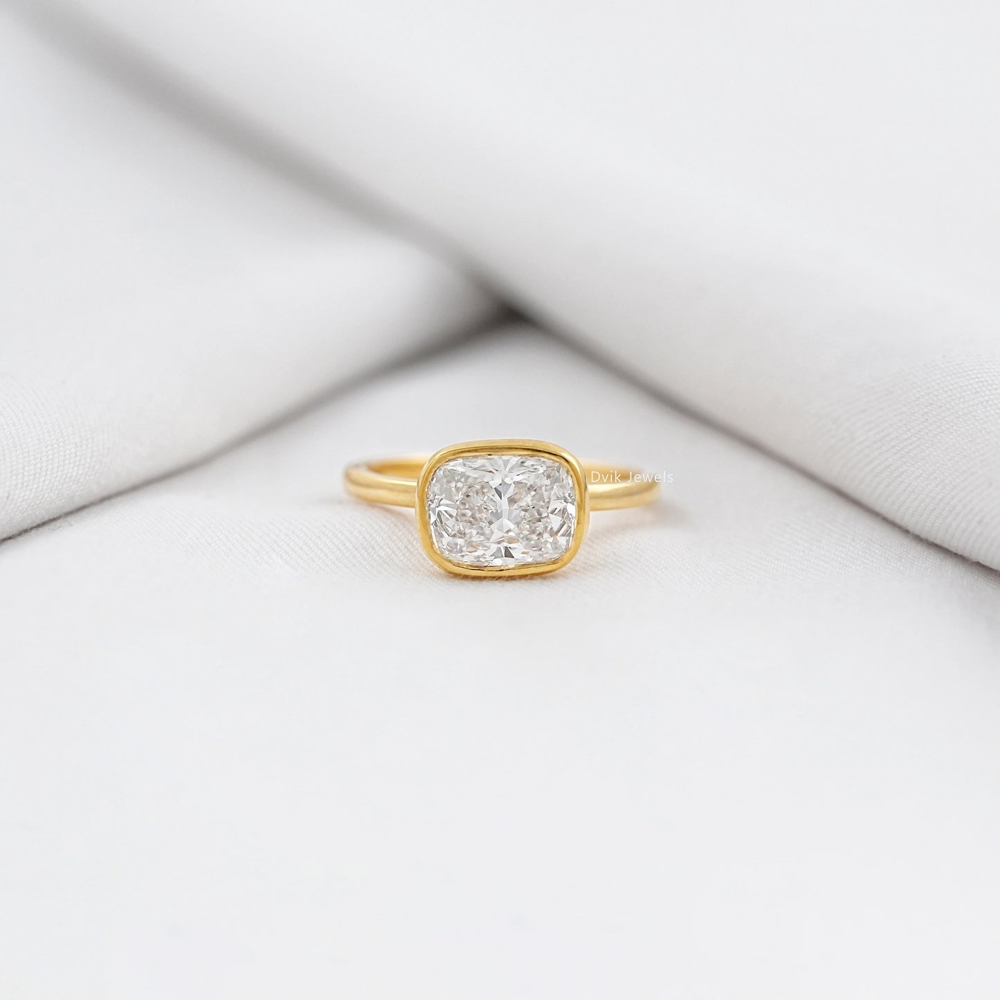 Cushion Cut East-West Bezel Solitaire Engagement Ring
