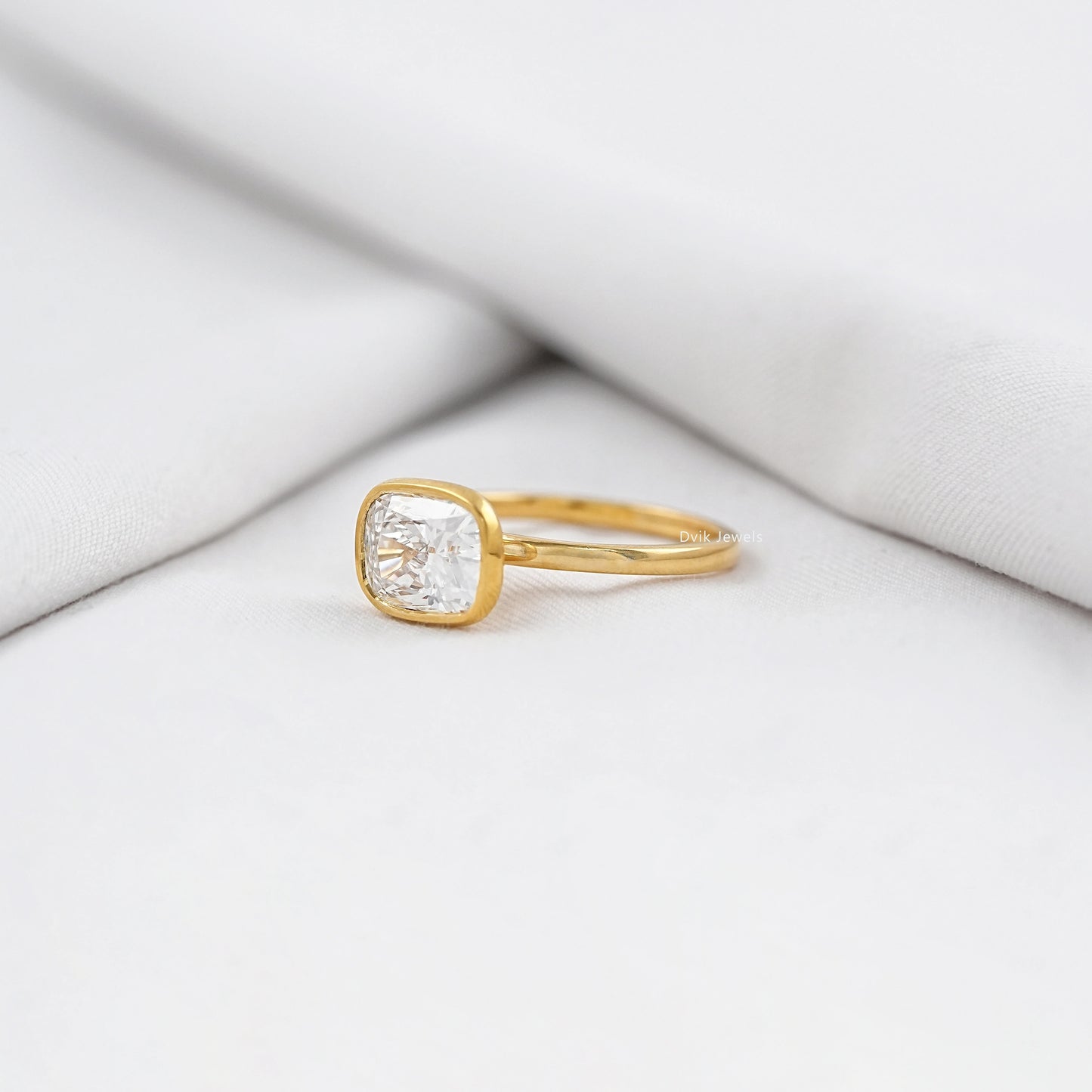 Cushion Cut East-West Bezel Solitaire Engagement Ring