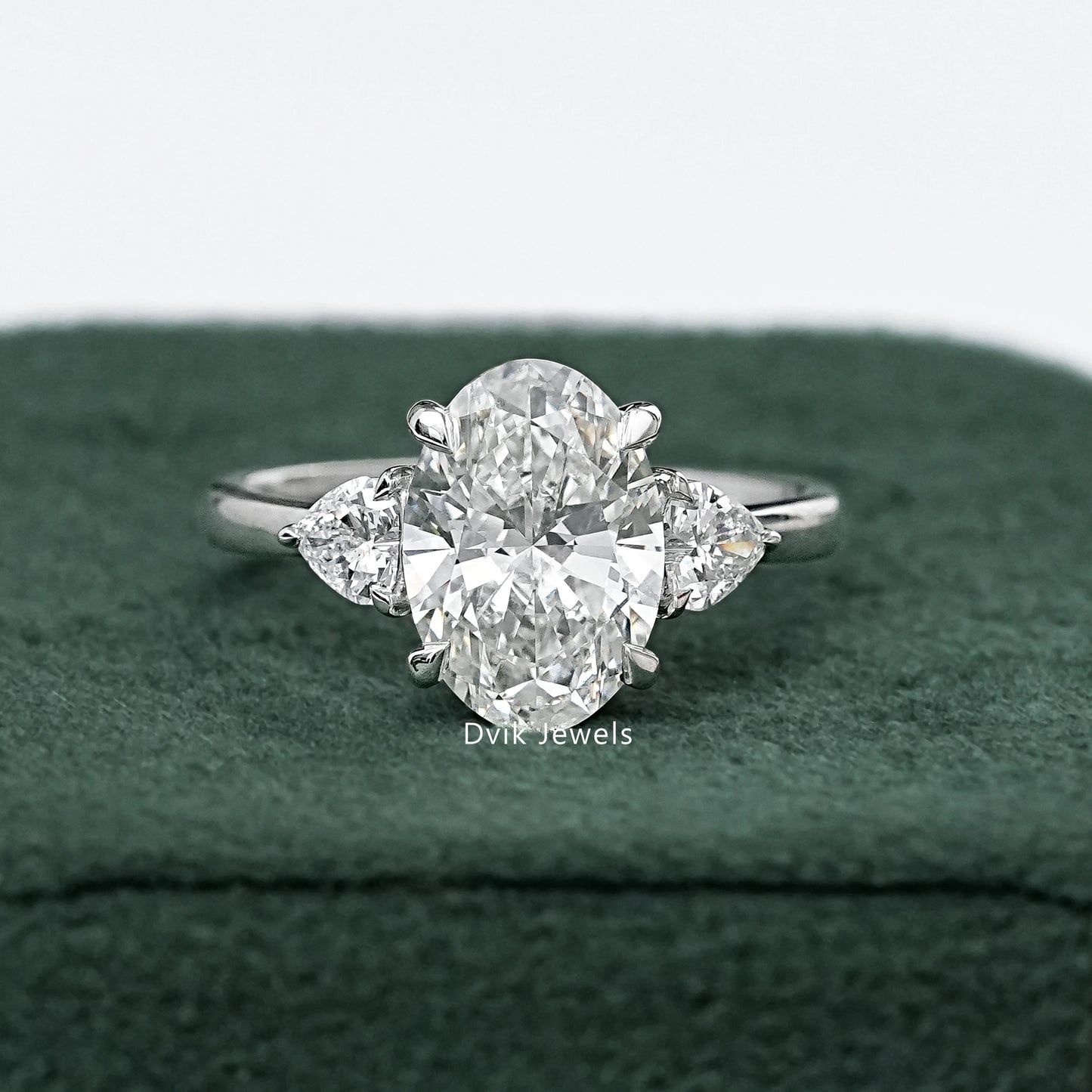 Three-Stone Oval And Round Cut Diamond Ring