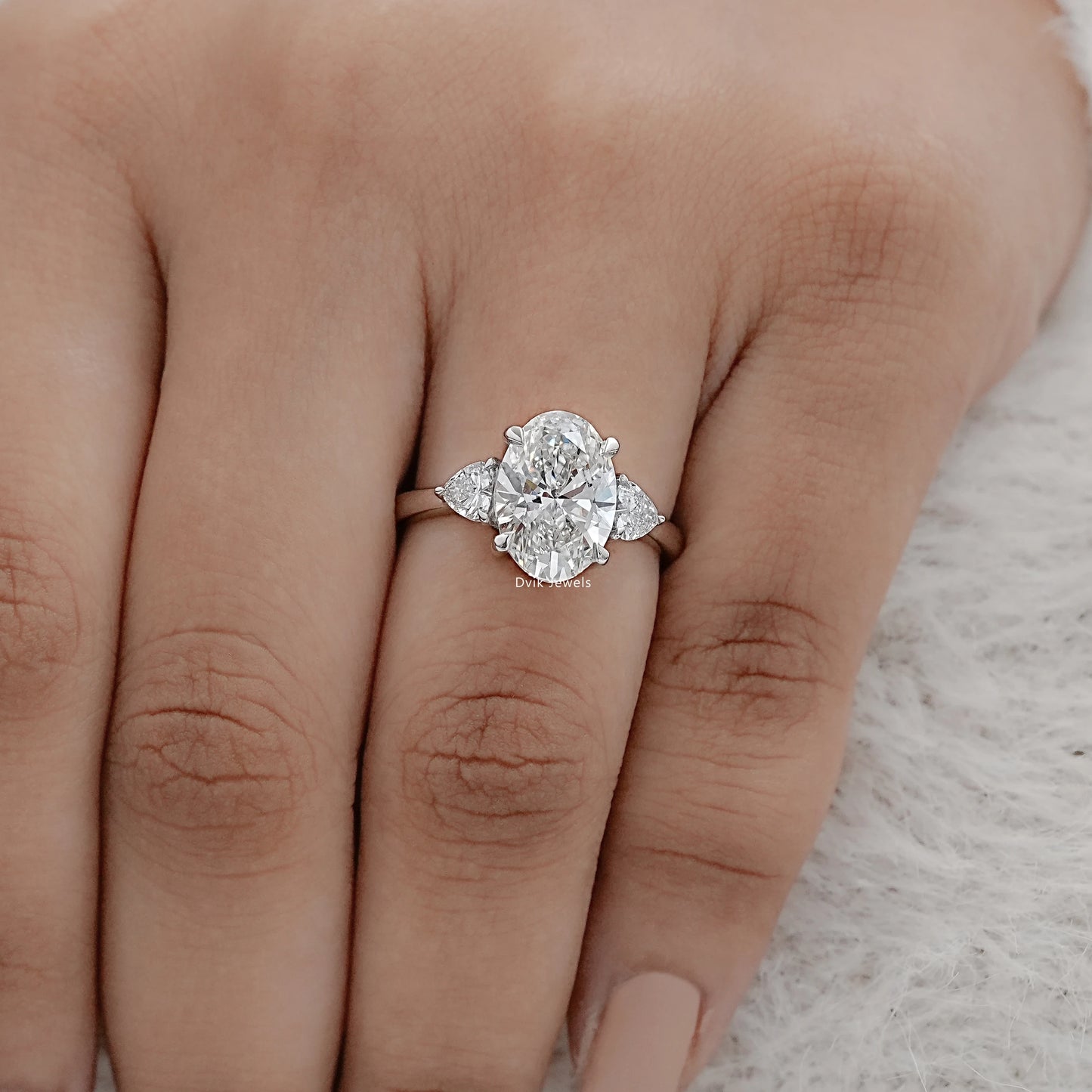 Three-Stone Oval And Round Cut Diamond Ring
