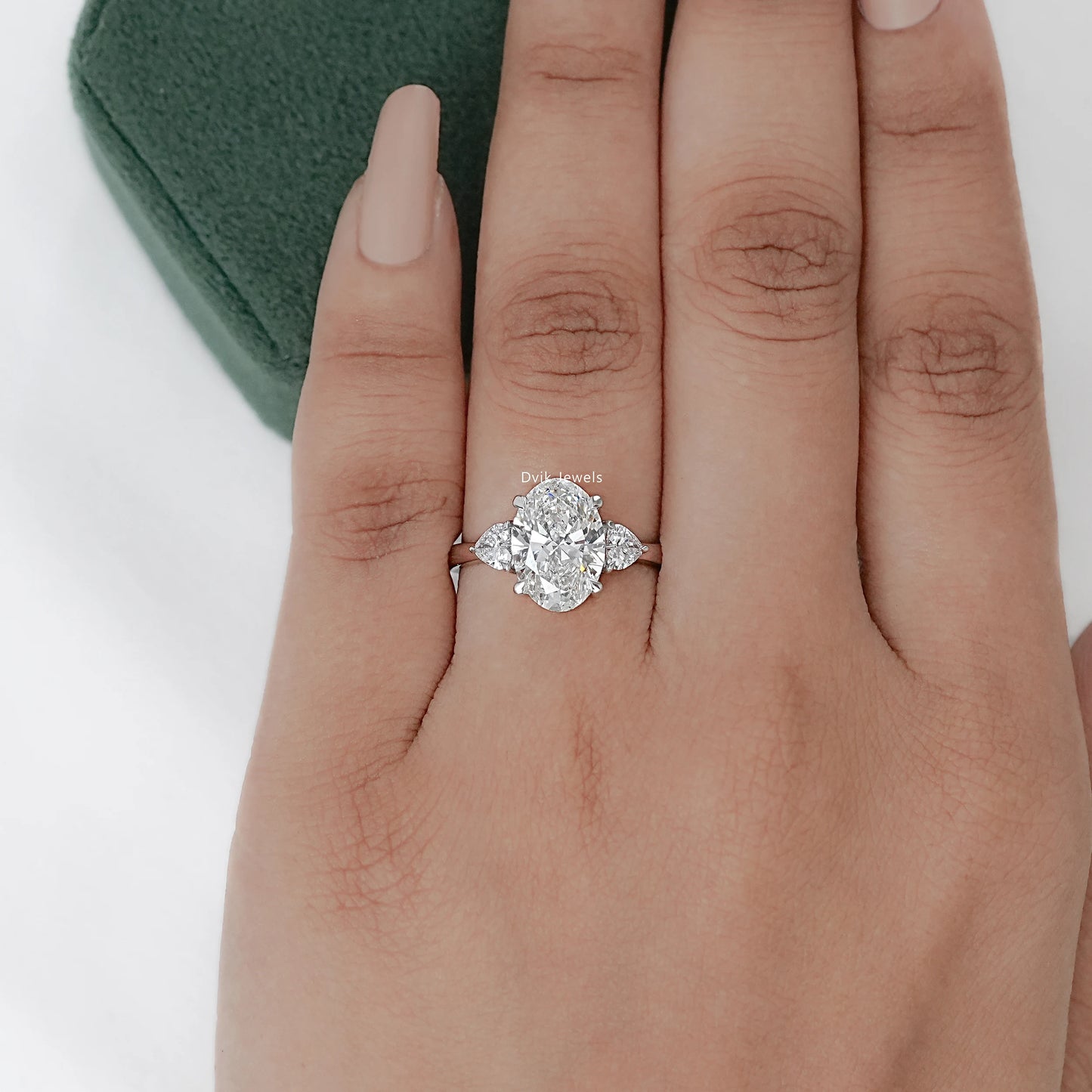 Three-Stone Oval And Round Cut Diamond Ring