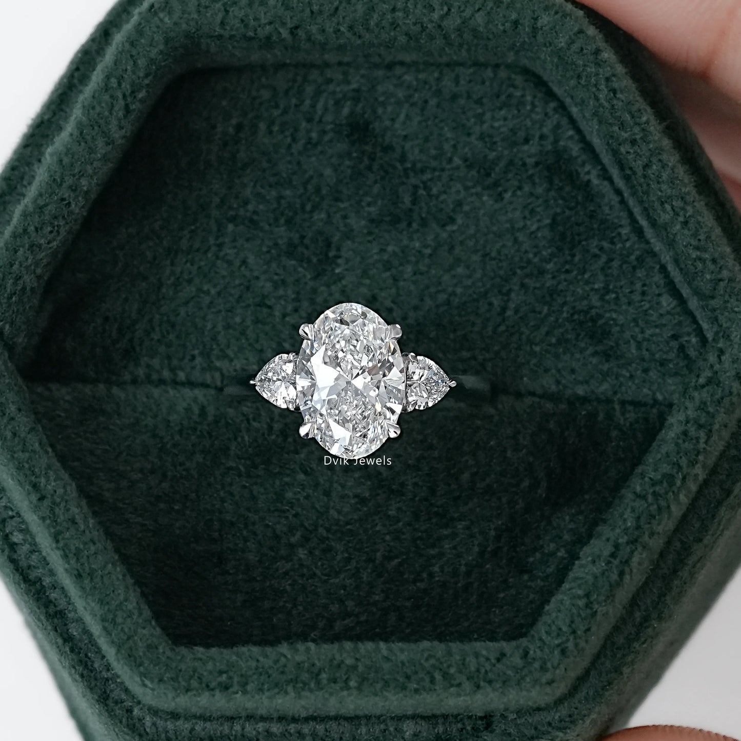 Three-Stone Oval And Round Cut Diamond Ring