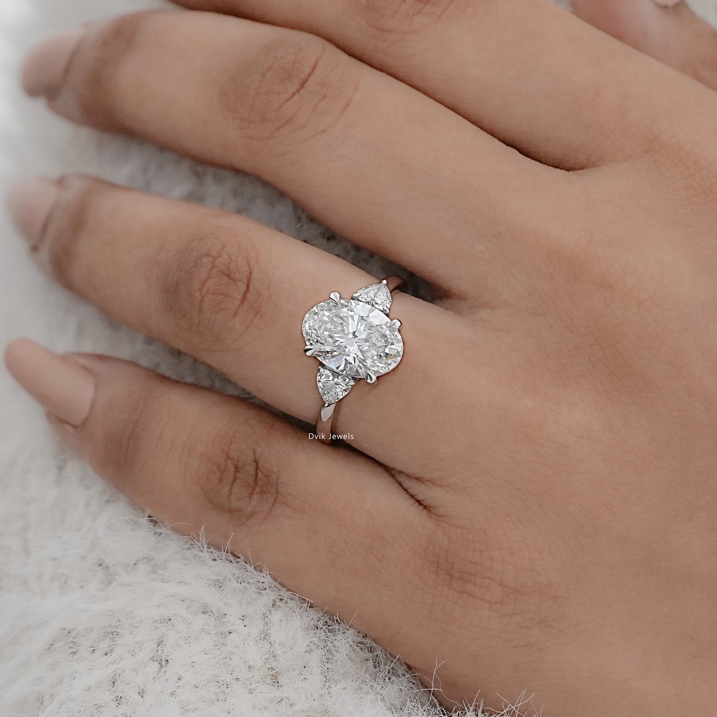 Three-Stone Oval And Round Cut Diamond Ring