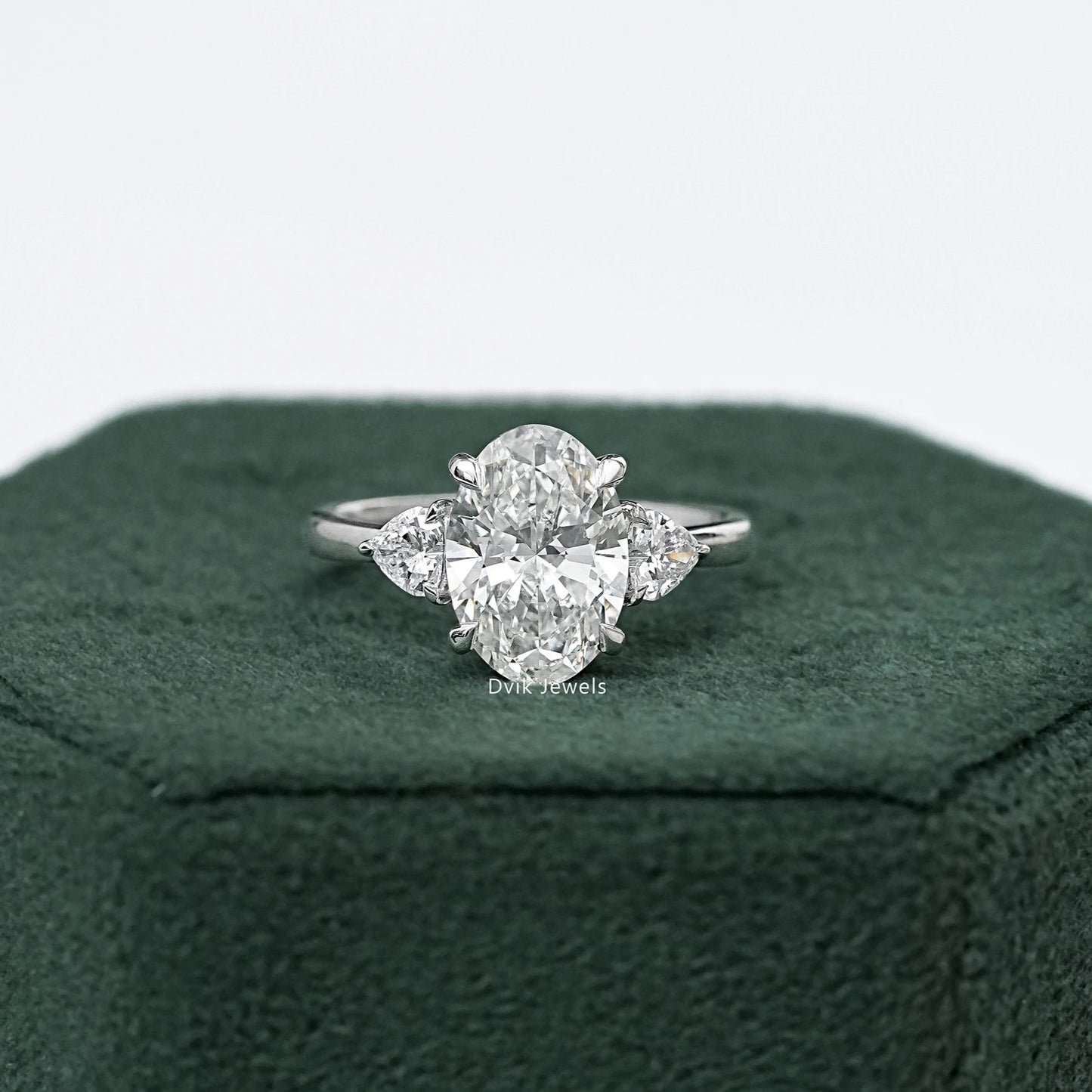 Three-Stone Oval And Round Cut Diamond Ring