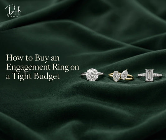 Engagement rings on dark fabric, while Dvik Jewels highlights tips for choosing an affordable ring on a tight budget.