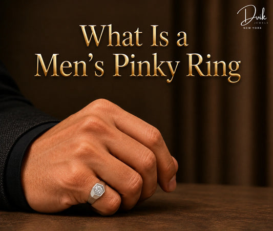 What Is a Men's Pinky Ring banner by Dvik Jewels featuring a diamond signet ring on pinky finger.