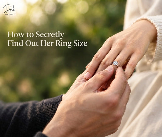 After measuring the woman's finger, a diamond-studded engagement ring from Dvik Jewels is being placed on her finger.