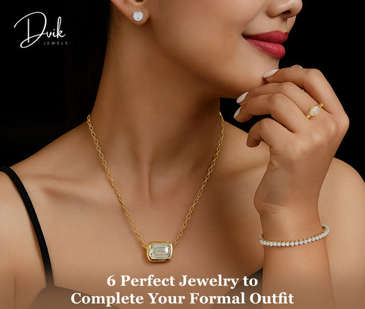 Woman wearing diamond pendant necklace, diamond bracelet, stud earrings, and engagement ring from Dvik Jewels for formal jewelry styling.