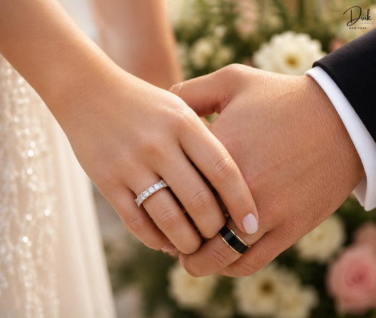Dvik Jewels matching wedding bands for couples under £1,500 featuring a women's gold lab-grown diamond eternity band and a modern black and gold men's ring.