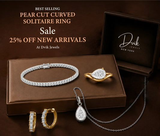Best-selling Pear Cut Curved Solitaire Ring and other fine jewelry pieces including a tennis bracelet, earrings, and necklace on sale with 25% off new arrivals at Dvik Jewels New York.