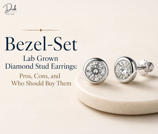 Bezel Set Lab Grown Diamond Stud Earrings displays a pair of bezel set earrings from Dvik Jewels on a cream-colored stand.