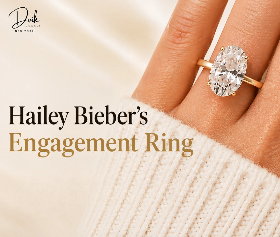 Close-up of an oval cut engagement ring on a hand, captioned as a replica of Hailey Bieber's engagement ring by Dvik Jewels.