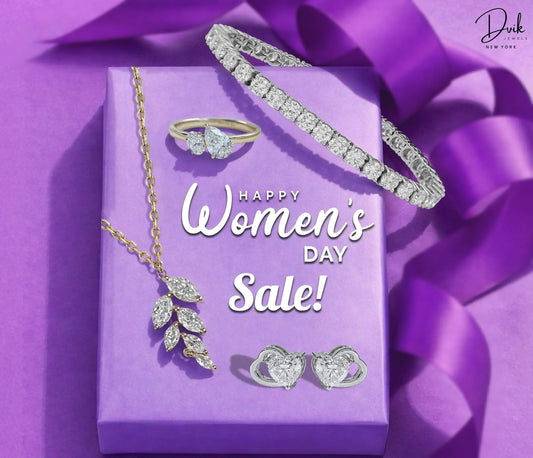 Dvik Jewels Women's Day Sale banner with diamond necklace, bracelet, and ring on a purple gift box.