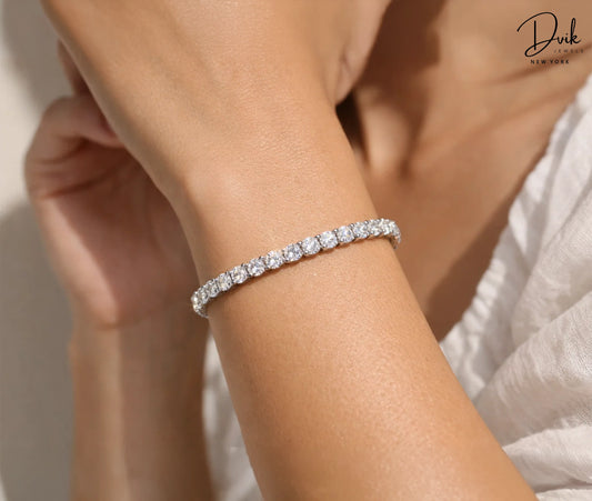 Round cut lab grown diamond tennis bracelet in white gold by Dvik Jewels New York.
