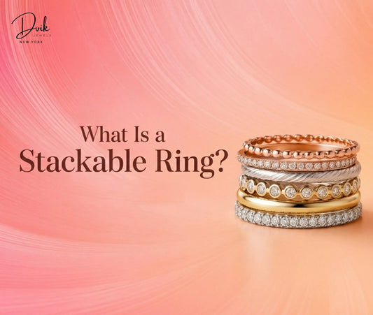 A stack of six assorted rings of different metals and styles against a peach background, with the heading What Is a Stackable Ring?