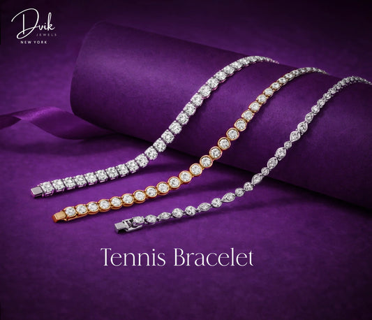 Dvik Jewels lab grown diamond tennis bracelets in gold and silver on purple velvet backdrop.