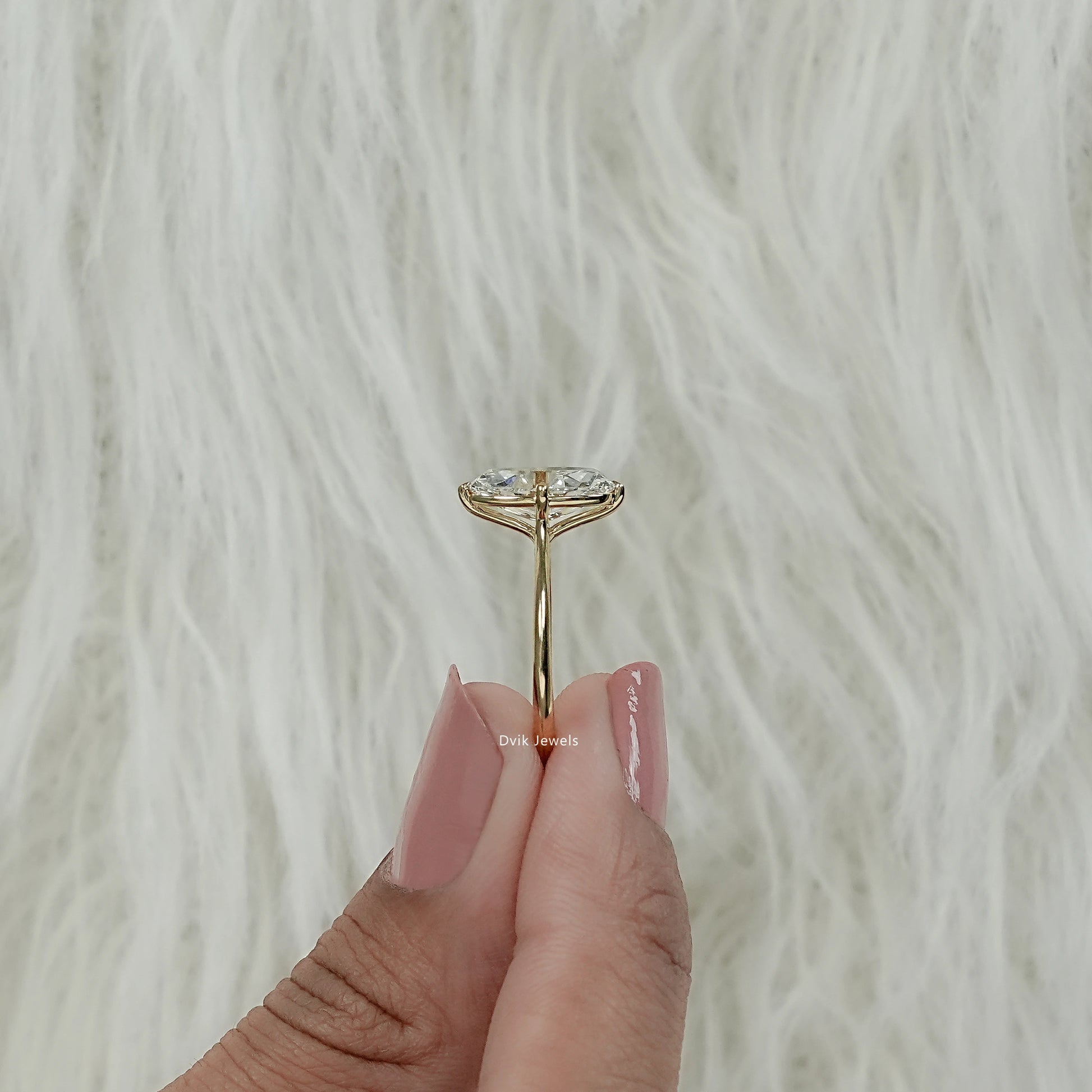 Detailed view of craftsmanship and underside of the Moval cut lab diamond engagement ring