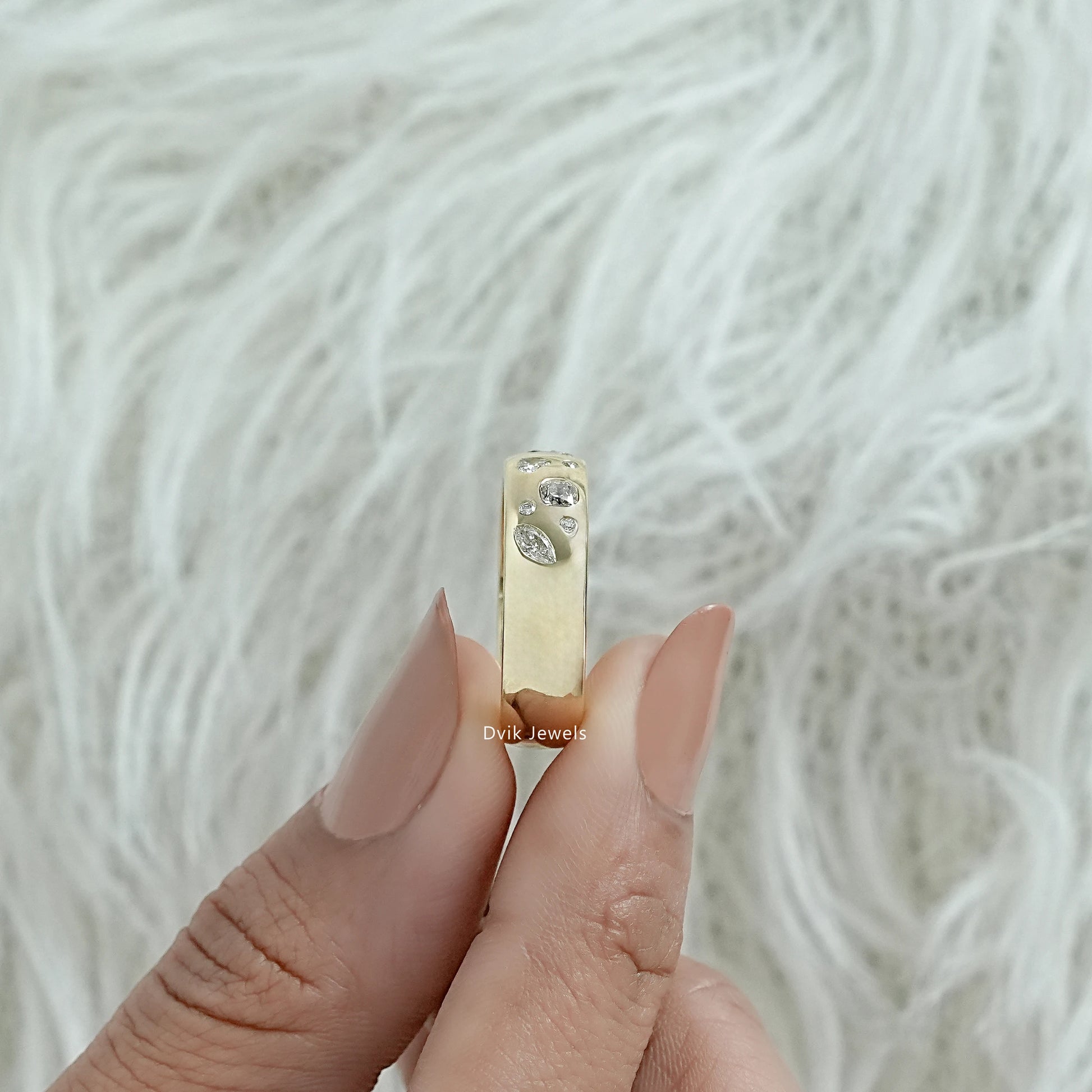 Multi stone engagement ring gold worn on a hand showing the flush design