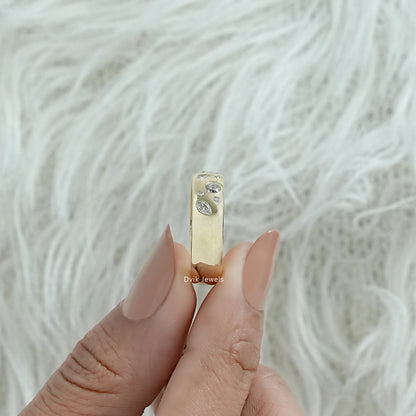 Multi stone engagement ring gold worn on a hand showing the flush design