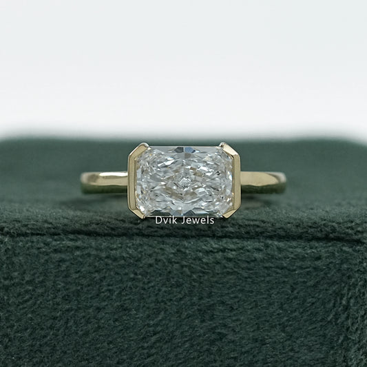 Radiant cut engagement rings bezel yellow gold front view on box