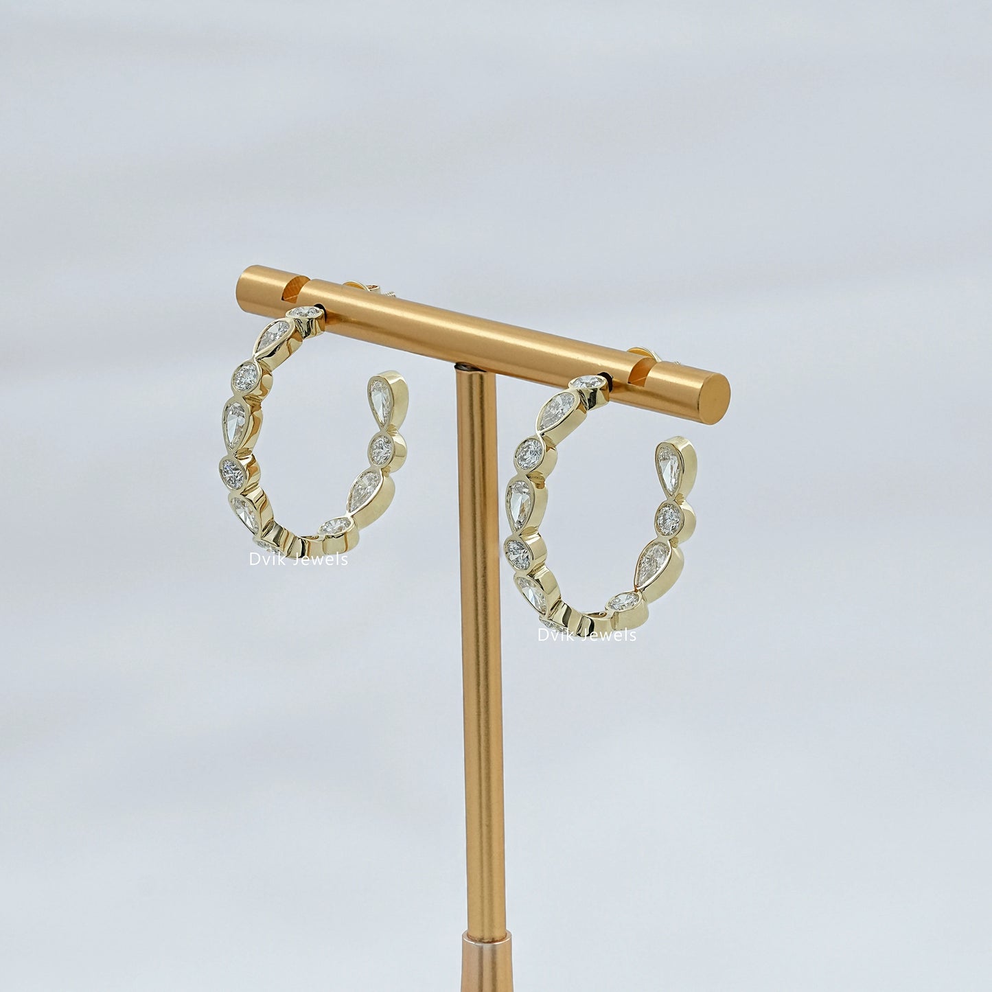 Bezel Set Pear And Round Diamond C Hoop Earrings