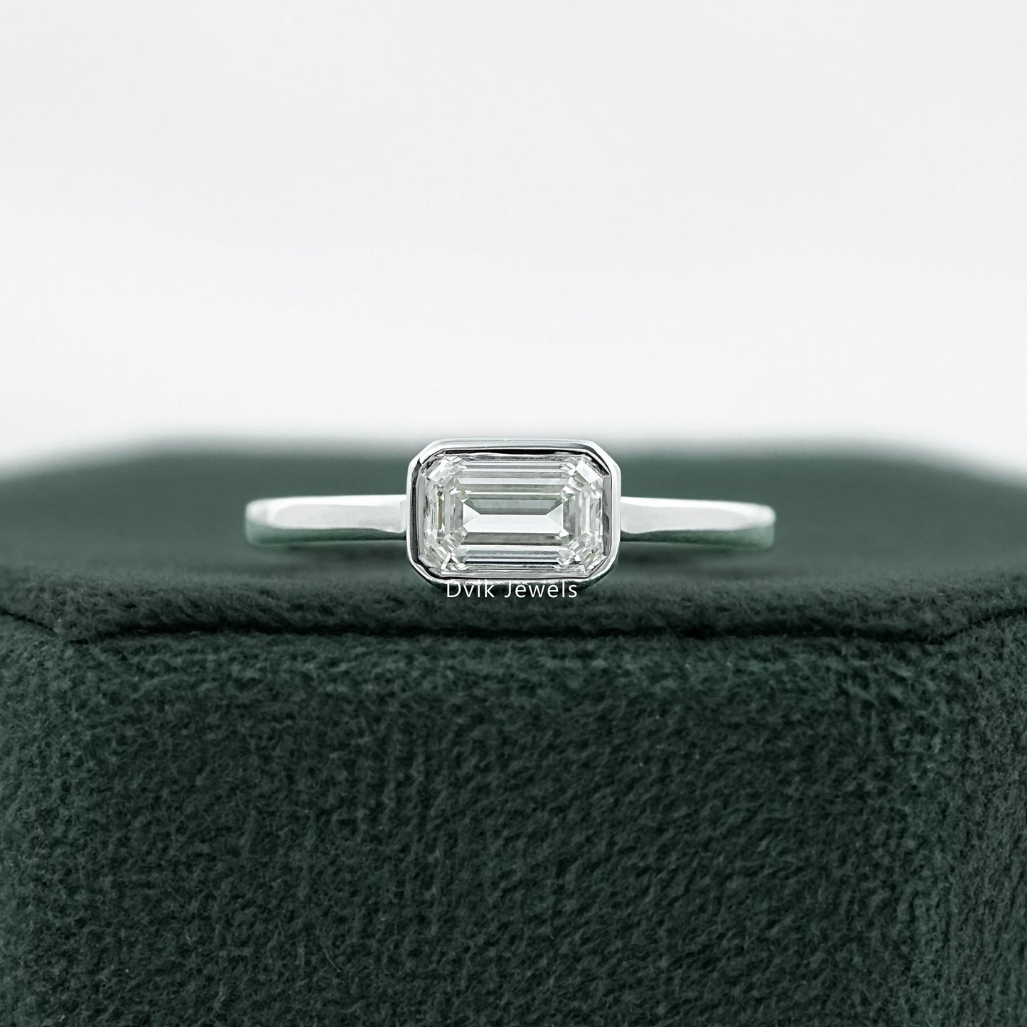 Bezel Set East-West Emerald Cut Engagement Ring