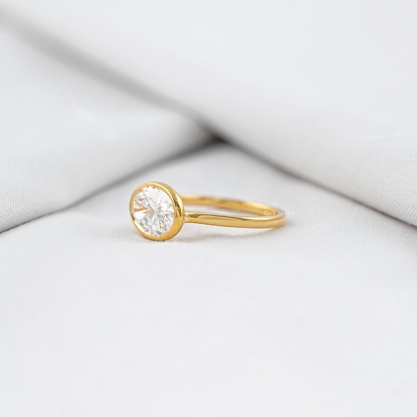 Oval East-West Bezel Engagement Ring