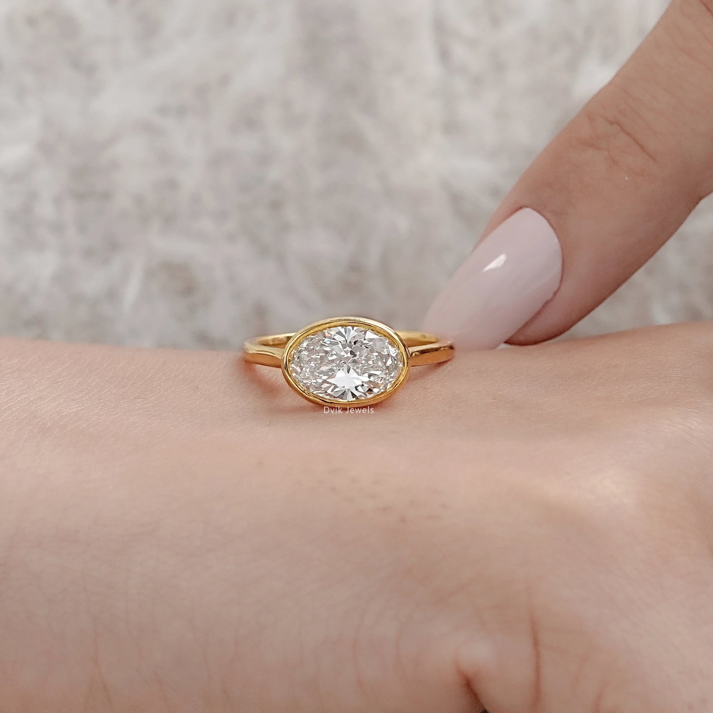 Oval East-West Bezel Engagement Ring