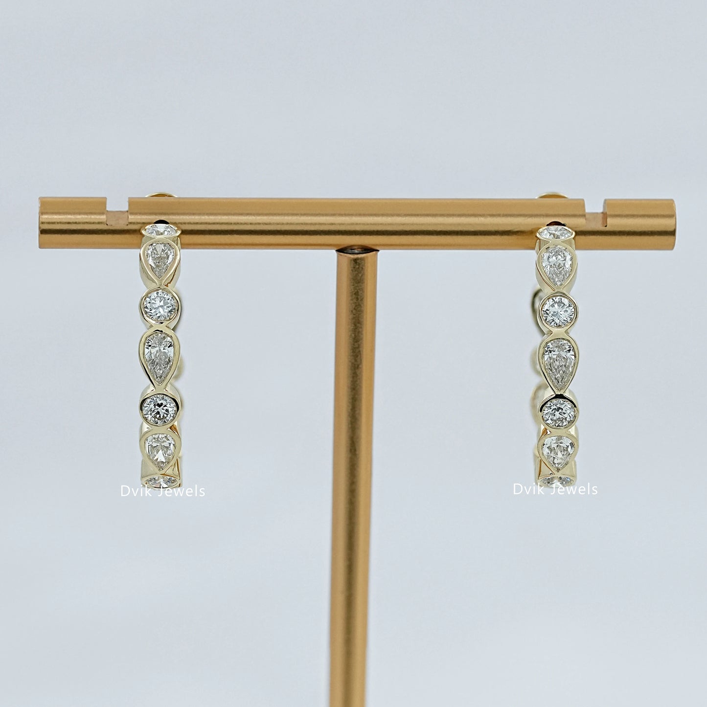 Bezel Set Pear And Round Diamond C Hoop Earrings