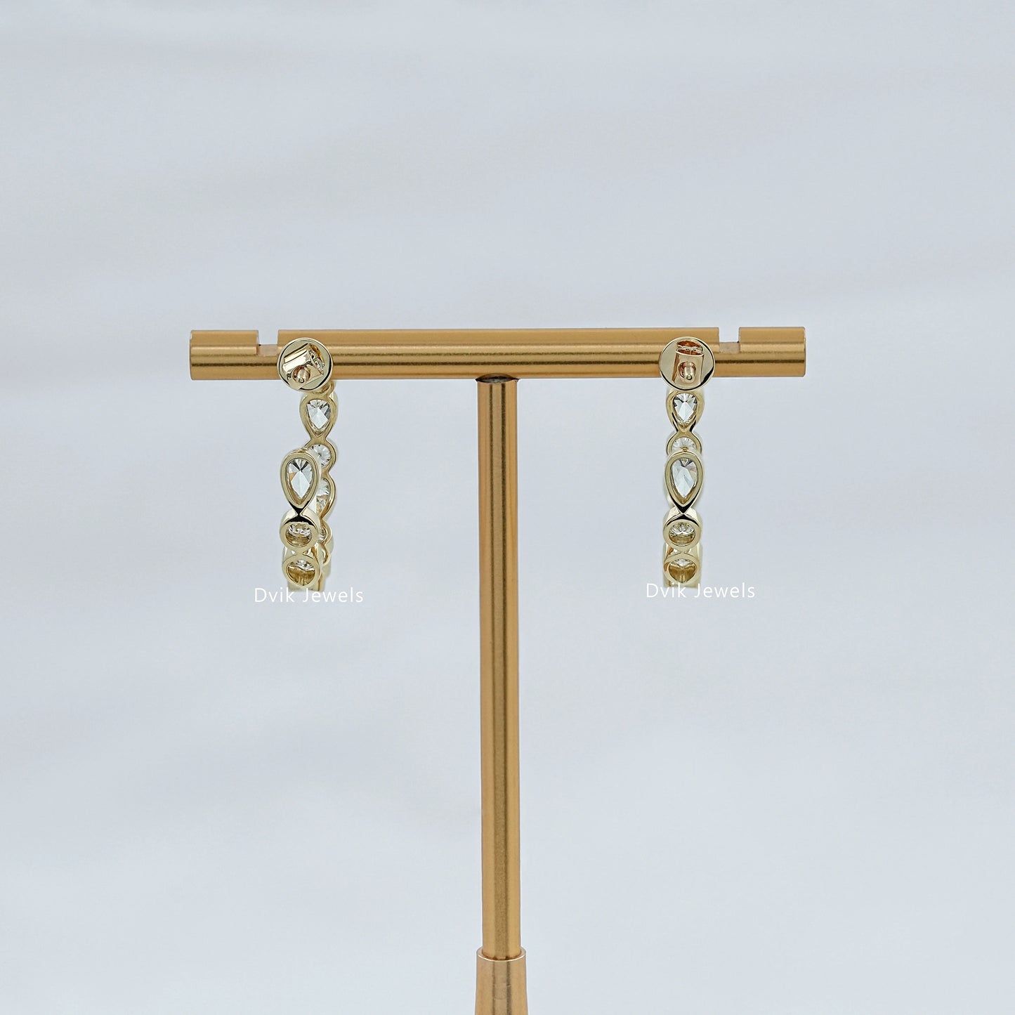 Bezel Set Pear And Round Diamond C Hoop Earrings