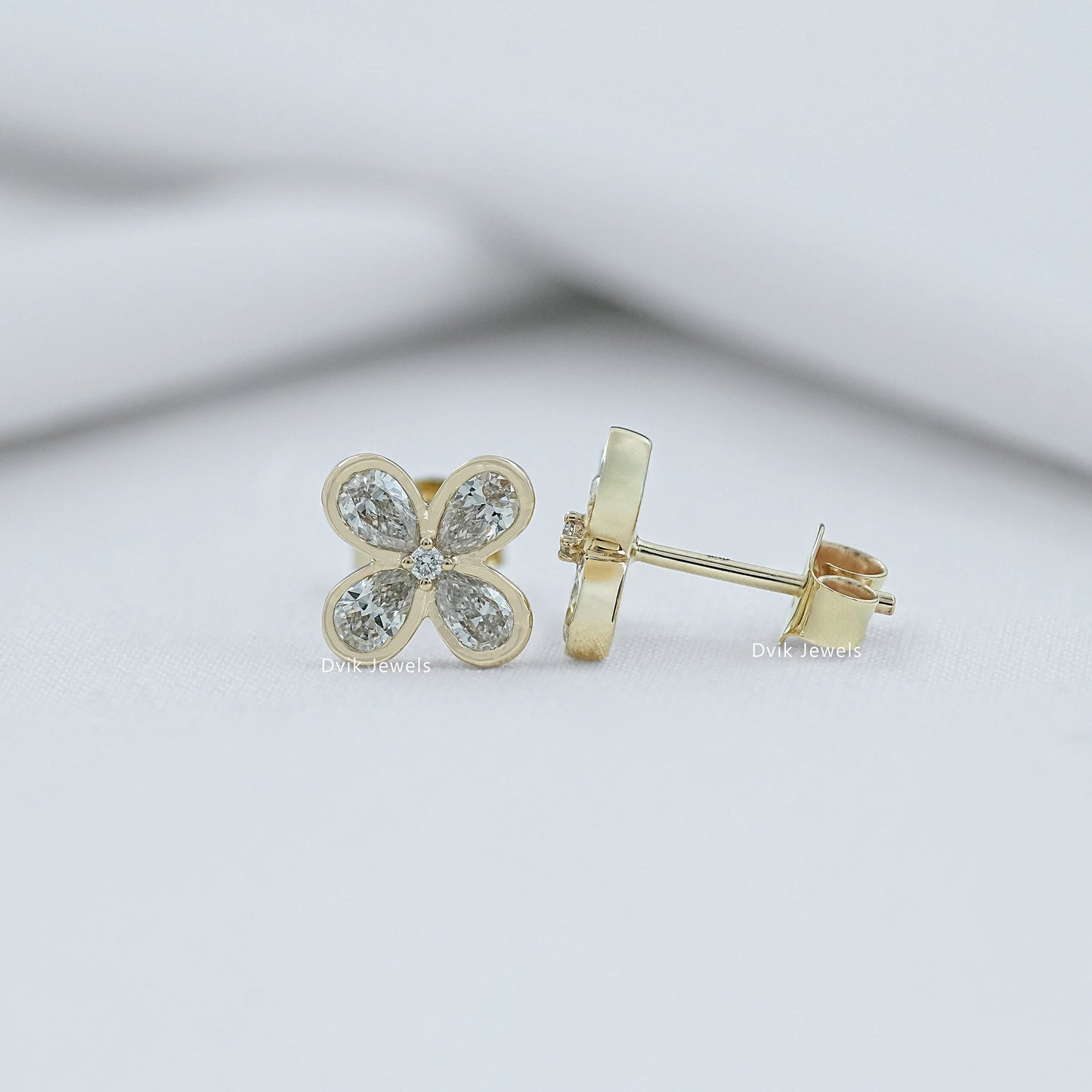 Bezel Set Pear Diamond Floral Stud Earrings