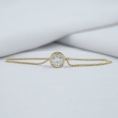 Bezel set diamond bracelet yellow gold front view on green box