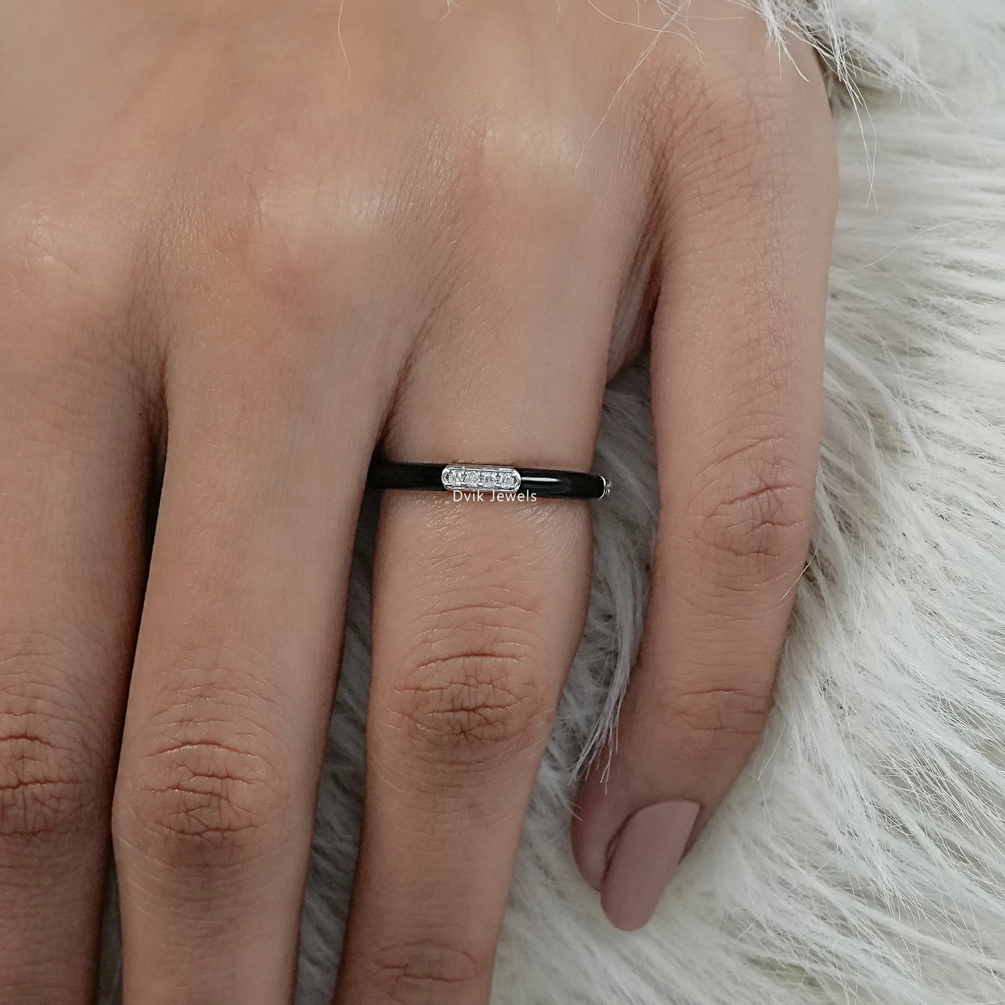 Black enamel band white gold round diamond bar setting on finger