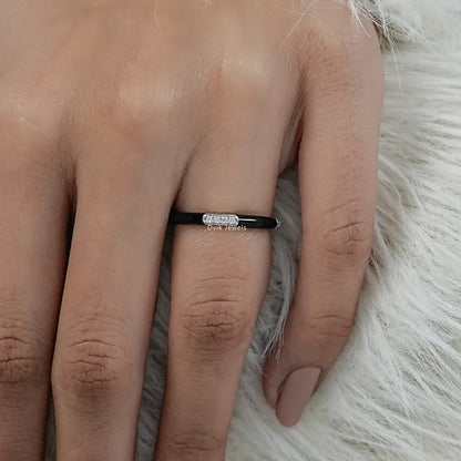 Black enamel band white gold round diamond bar setting on finger