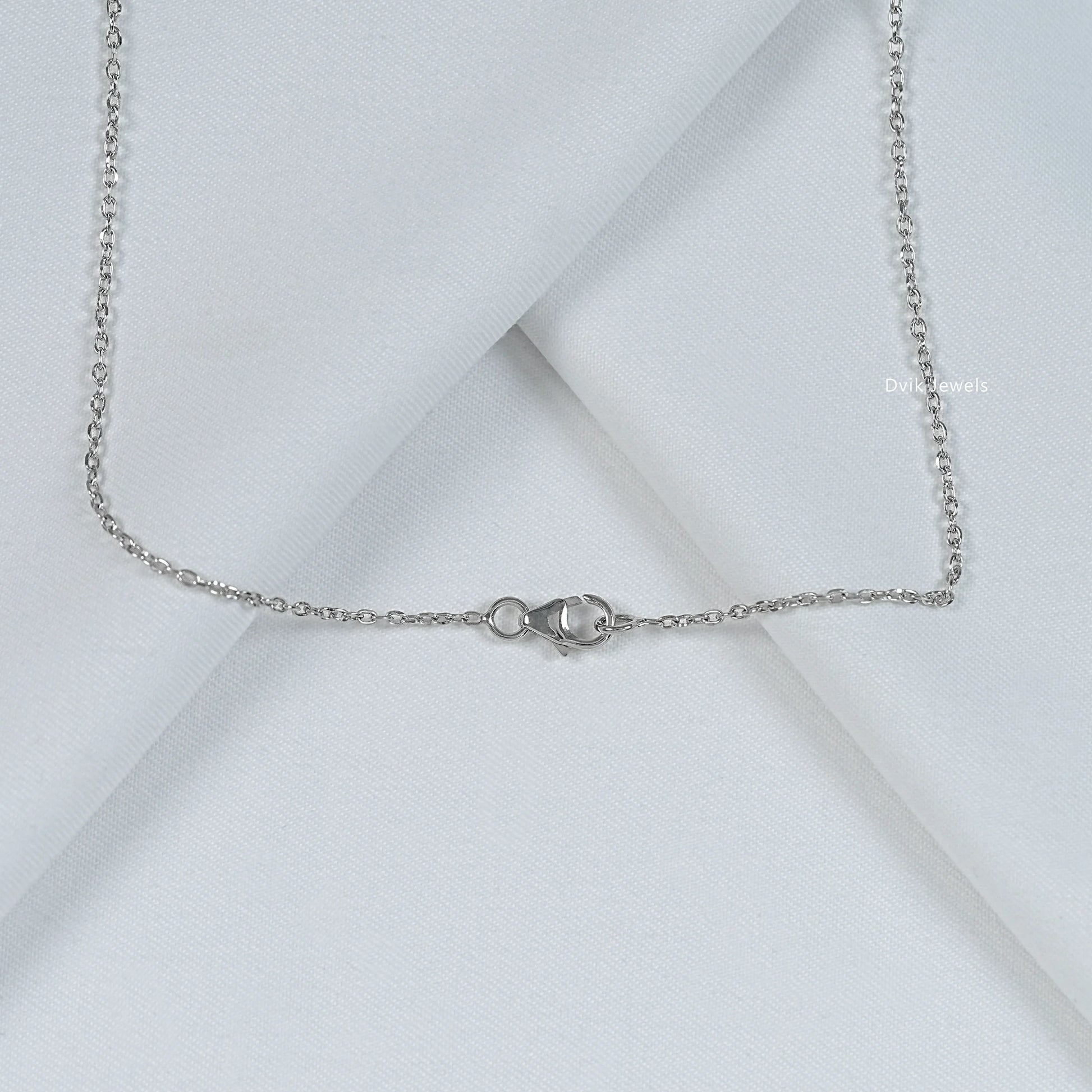 Floral pendant with pear and round cut diamond and white gold chain to display lock view