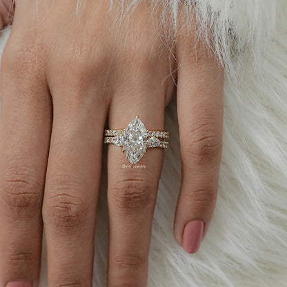 Top view of marquise diamond bridal set with pave-set lab diamond wedding bands worn by women