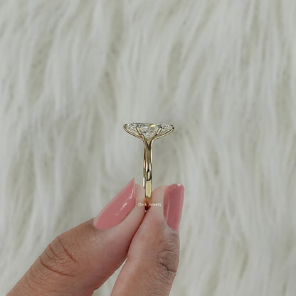 Lab grown marquise diamond ring with solitaire setting, capturing antique-style facets.
