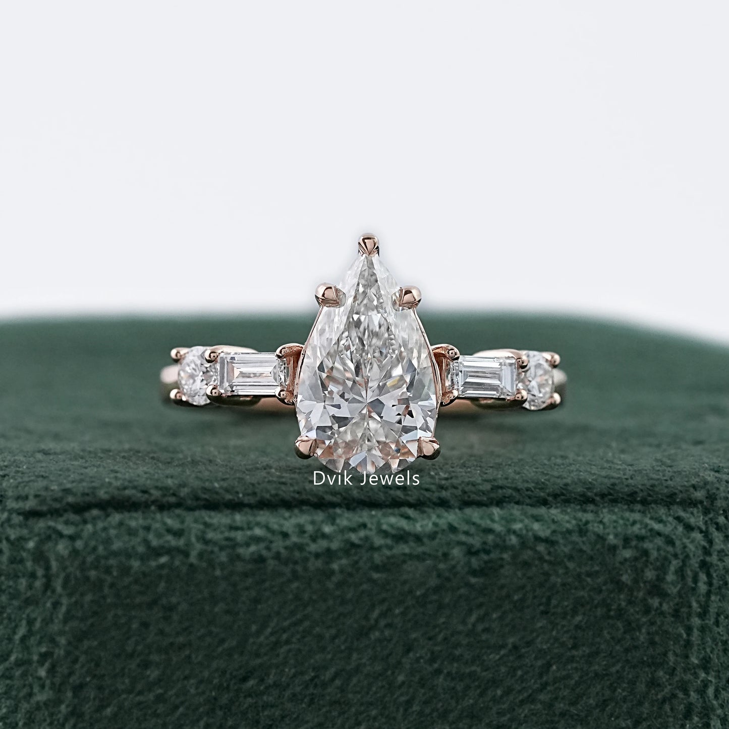Dvik Jewels showing five stone pear and baguette lab diamond ring in yellow gold