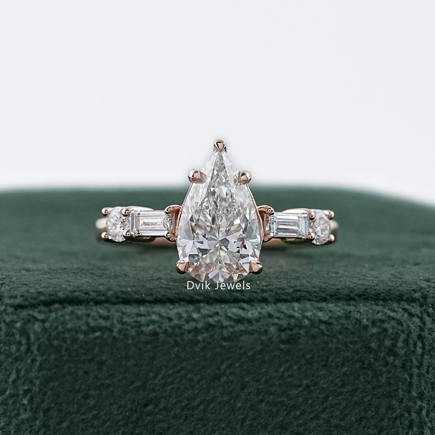 Dvik Jewels showing five stone pear and baguette lab diamond ring in yellow gold