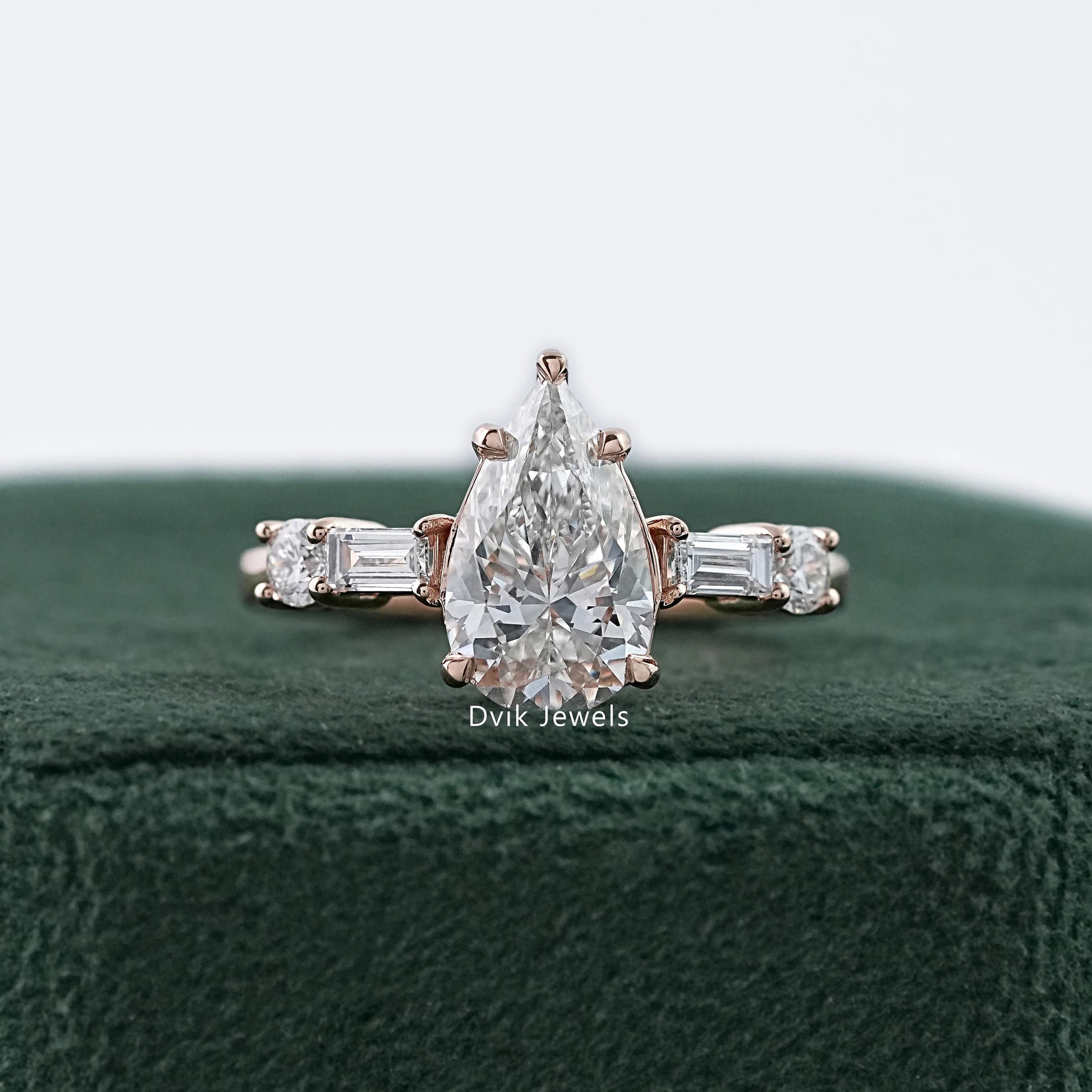 Dvik Jewels showing five stone pear and baguette lab diamond ring in yellow gold