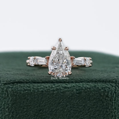 Dvik Jewels showing five stone pear and baguette lab diamond ring in yellow gold