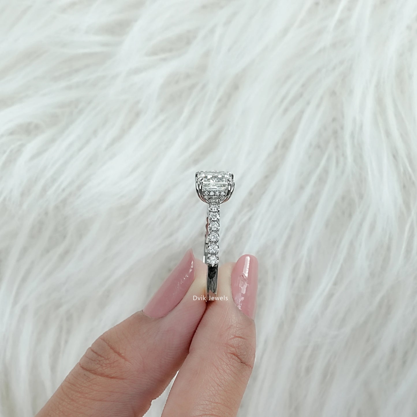 Lab Diamond Princess Cut Engagement Ring shown from side angle held by woman revealing accent band