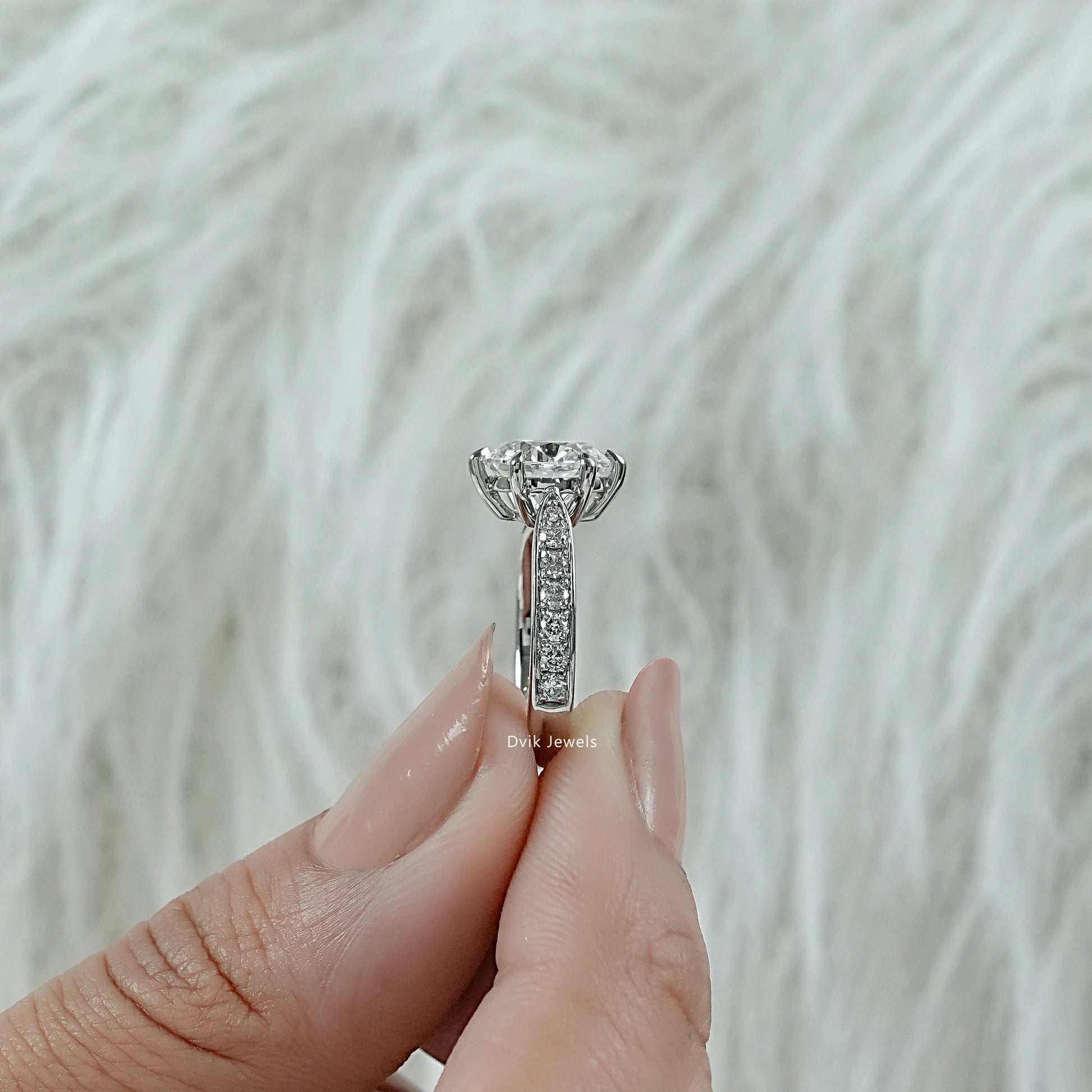 2 carat round diamond engagement ring bezel set in white gold eternity band