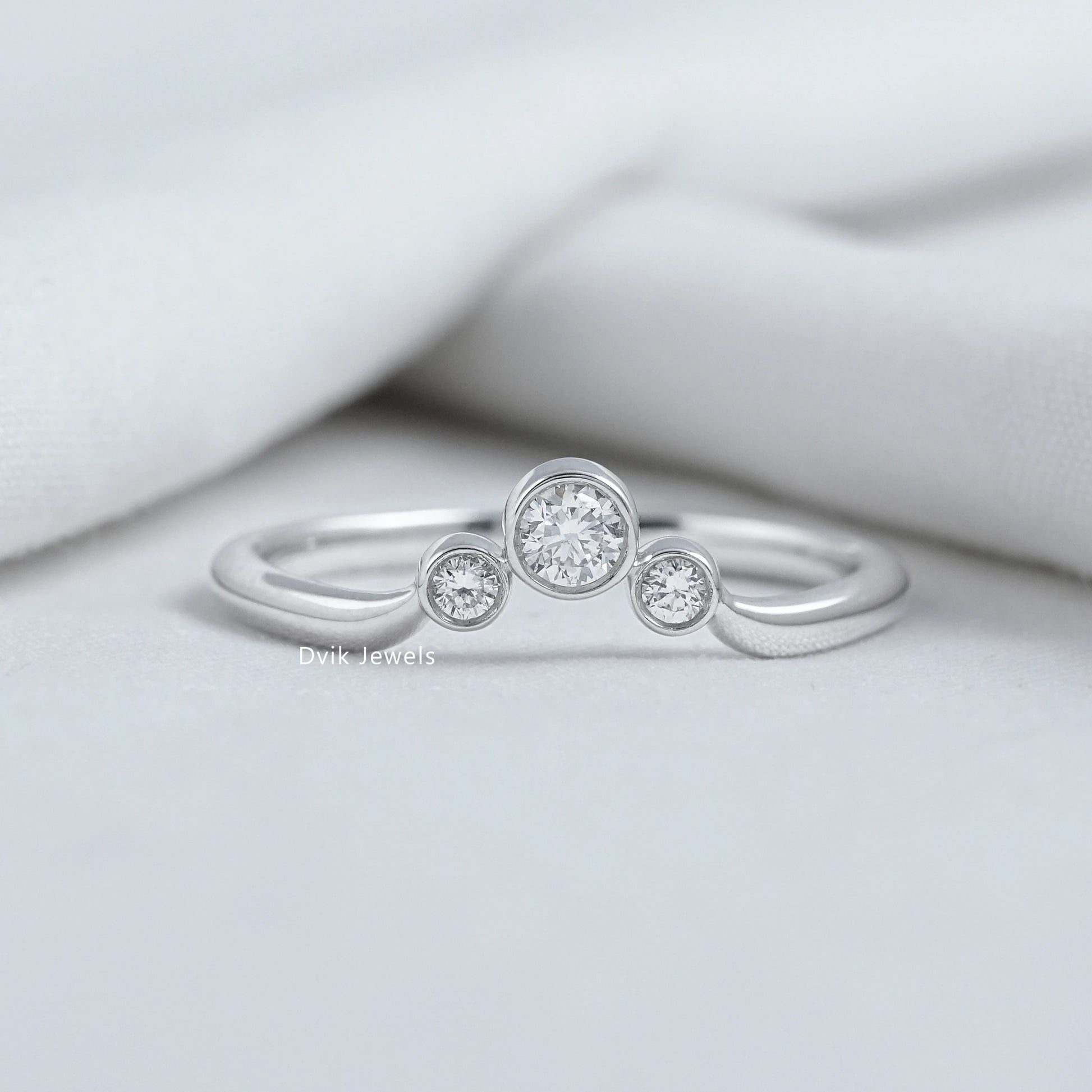 Three stone diamond curved ring lab grown in 14k gold setting.