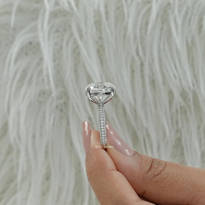 Engagement ring round with side stones and micro pave accents close up view