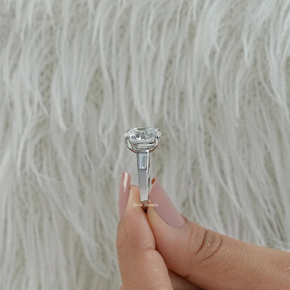 Engagement ring with baguettes on side round lab diamond engagement ring close up