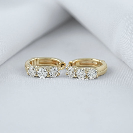 Three stone round cut huggie hoop earrings in yellow gold by Dvik Jewels