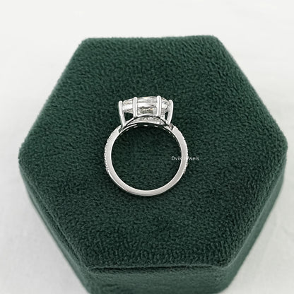 Pavé engagement rings featuring a pear center stone shown from a back view.