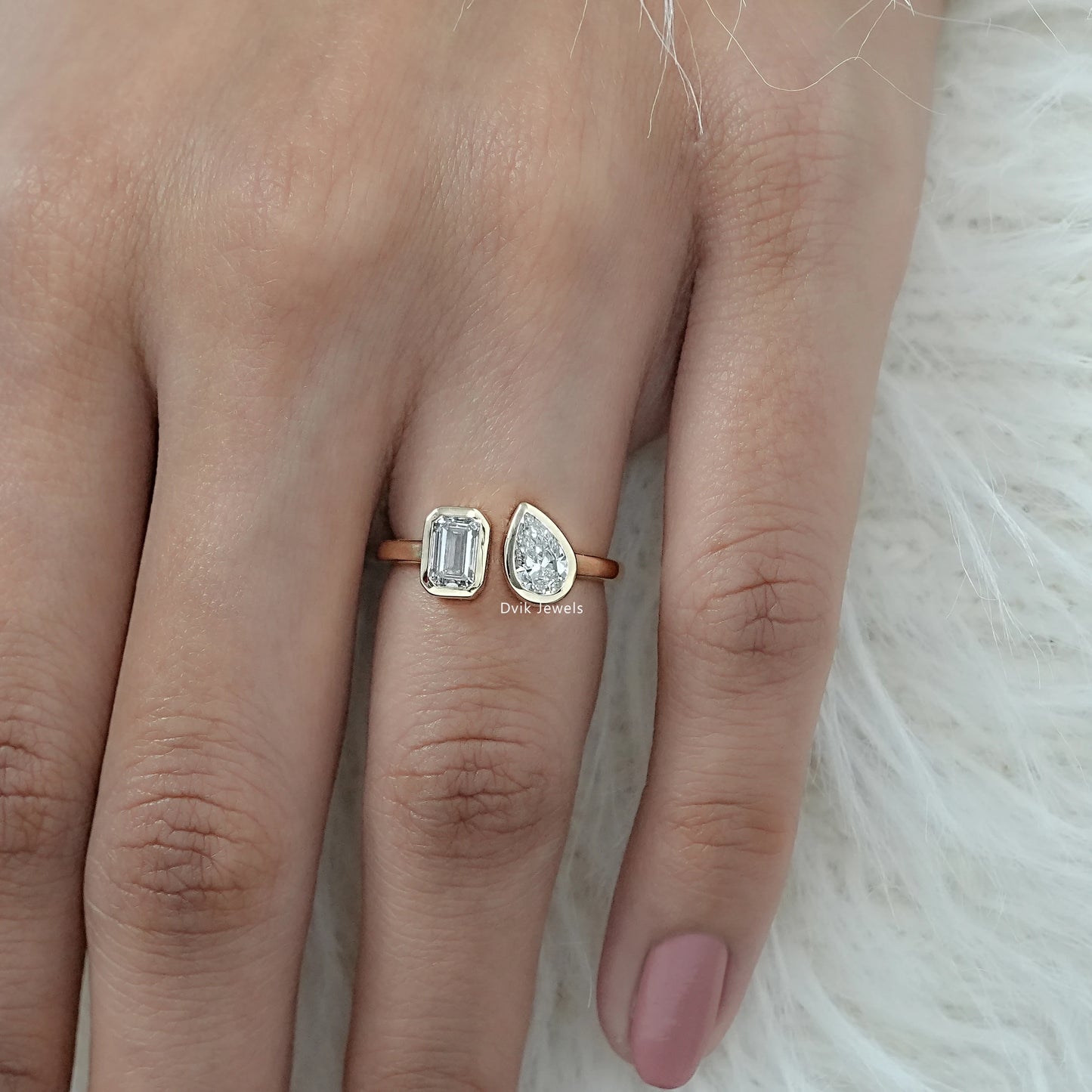 Emerald and Pear Cut Lab Grown Diamond Bezel Set Toi Moi Ring on hand showing dual-stone design